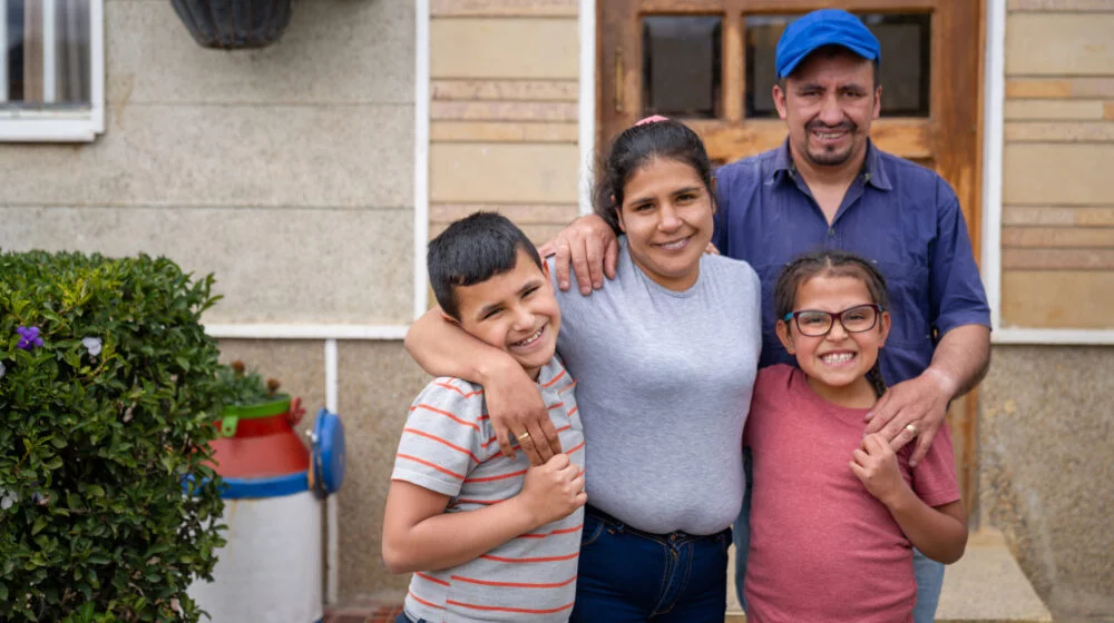 Family portrait outside a house.