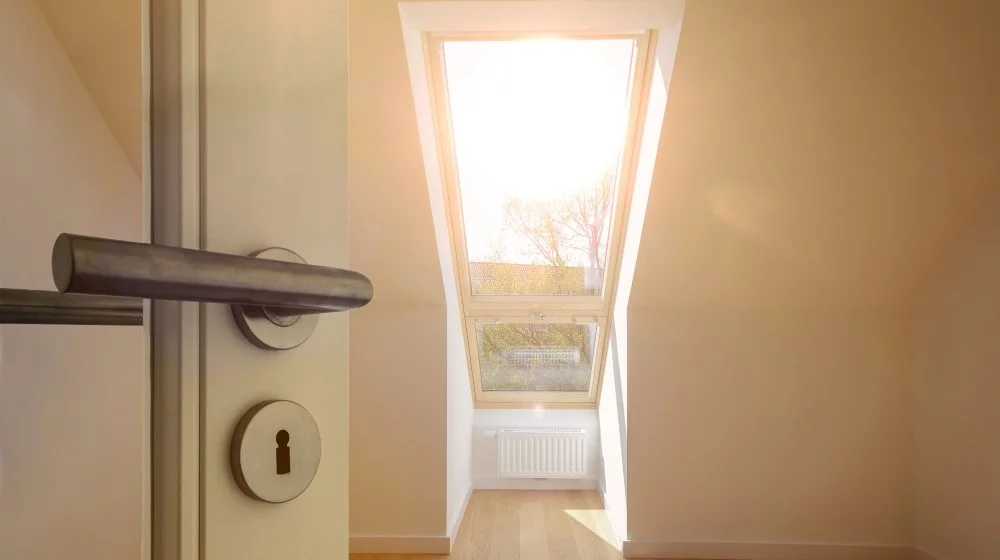 Door handle and skylight in room.