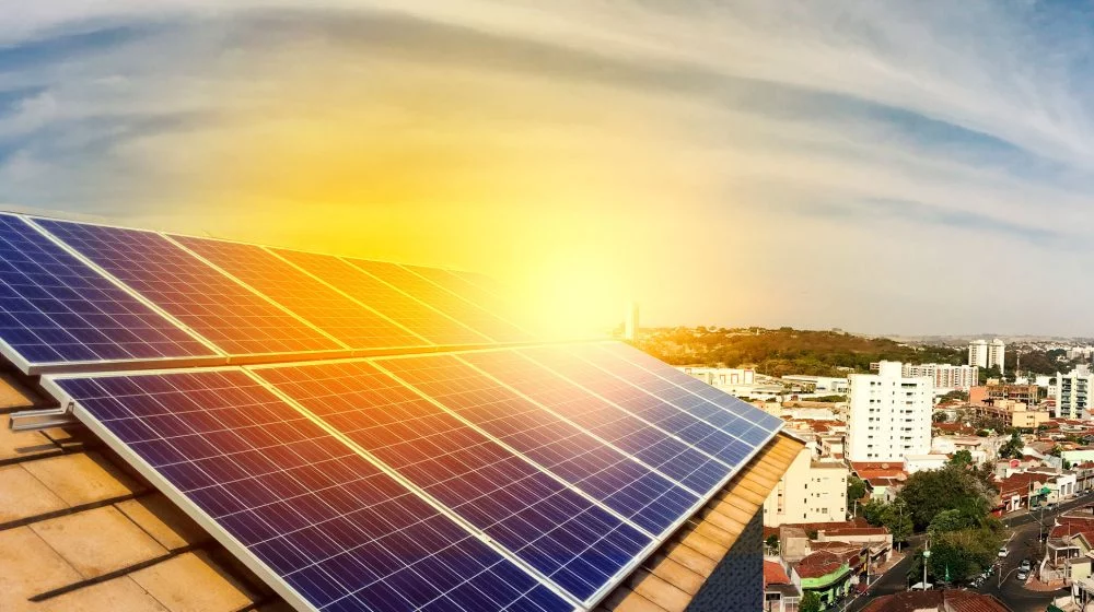 Solar panels on a rooftop in a city.